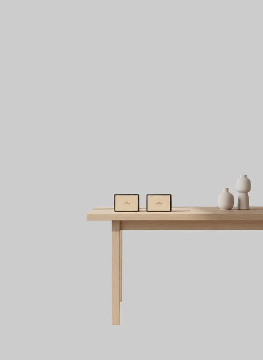 Two makeup compact cases on a textured surface