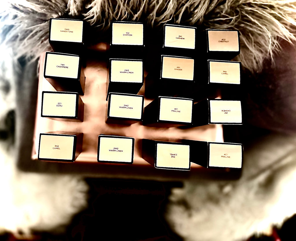 Collection of black boxes with visible brand names on a textured surface