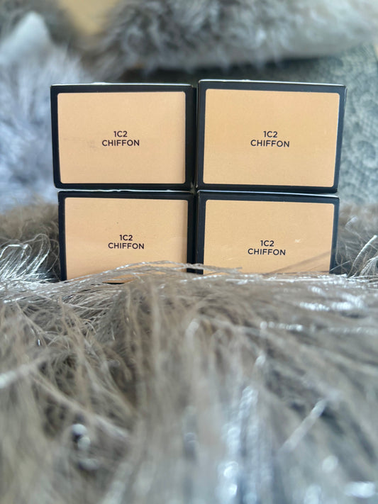 Four boxes of 1C2 Chiffon on a textured surface